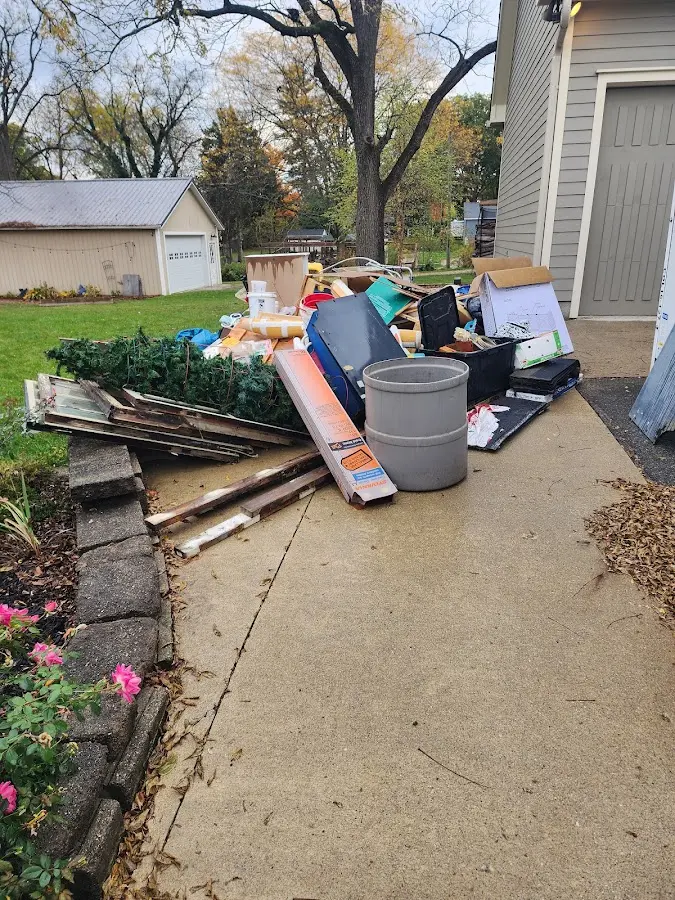 Dumpster being loaded with debris for Demolition Dumpster Rental in Hyrum